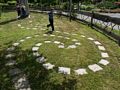 Miranda and Joyce at the chimes and Matthew on the spiral trail.<br />July 28, 2017 - The Gardens at Elm Bank, Wellesley, Massachusetts.