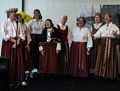 A group of women singing.<br />Latvian Song and Dance Festival.<br />June 30, 2017 - At the Renaissance Hotel in Baltimore, Maryland.
