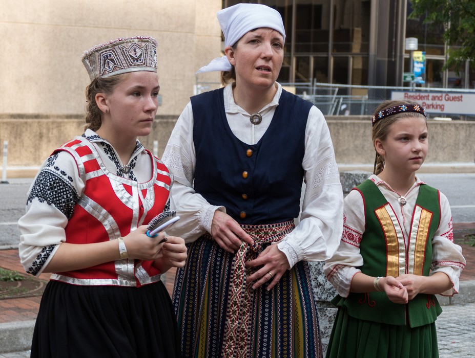 Dancers outside the arena.<br />Latvian Song and Dance Festival.<br />July 2, 2017 - Royal Farms Arena, Baltimore, Maryland.