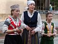 Dancers outside the arena.<br />Latvian Song and Dance Festival.<br />July 2, 2017 - Royal Farms Arena, Baltimore, Maryland.