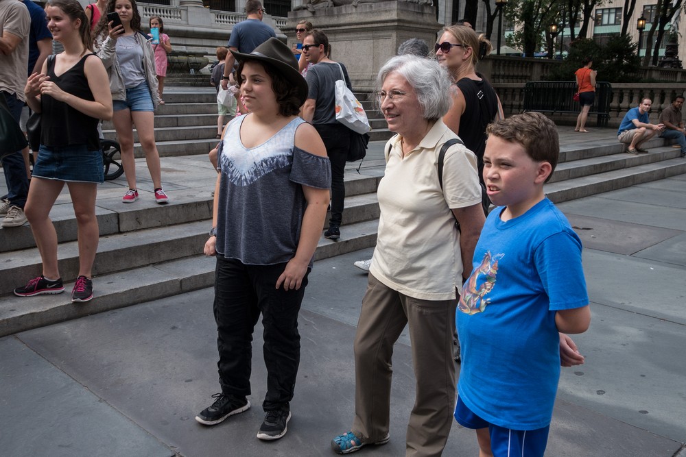 Miranda, Joyce, and Matthew being entertained by the street dancers.<br />July 12, 2017 - Manhattan, New York City, New  York.