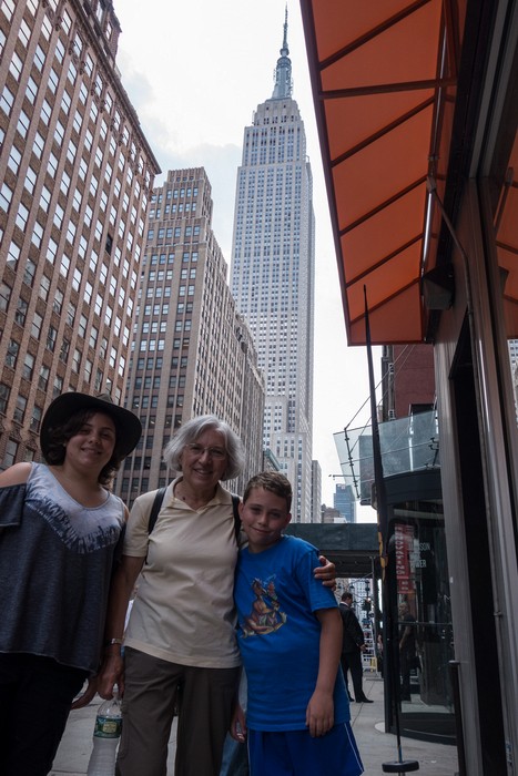 Miranda, Joyce, and Matthew in front of a Baskin Robbins and the Empire State Building in back.<br />July 12, 2017 - Manhattan, New York City, New  York.