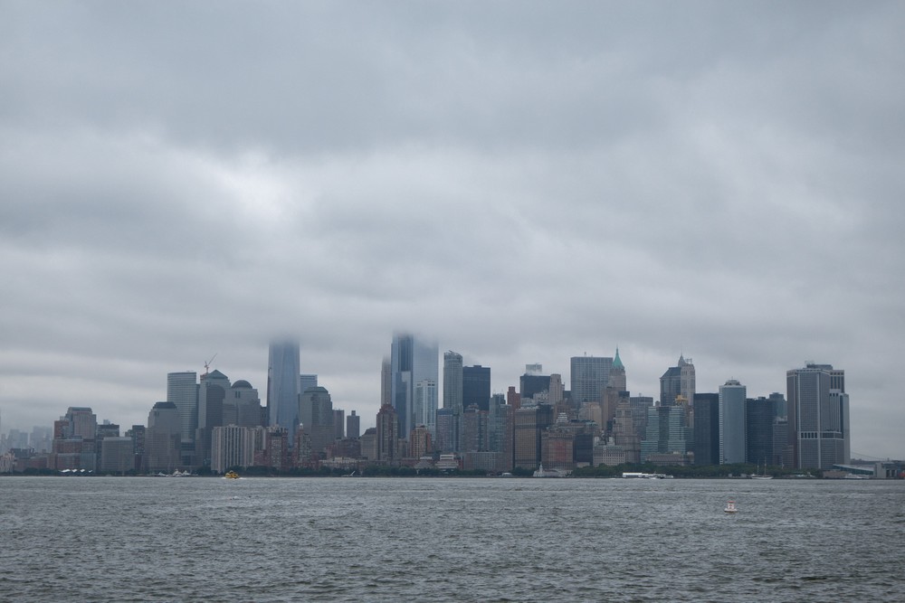 Lower Manhattan from ferry to Liberty Island.<br />July 13, 2017 - Manhattan, New York City, New  York.