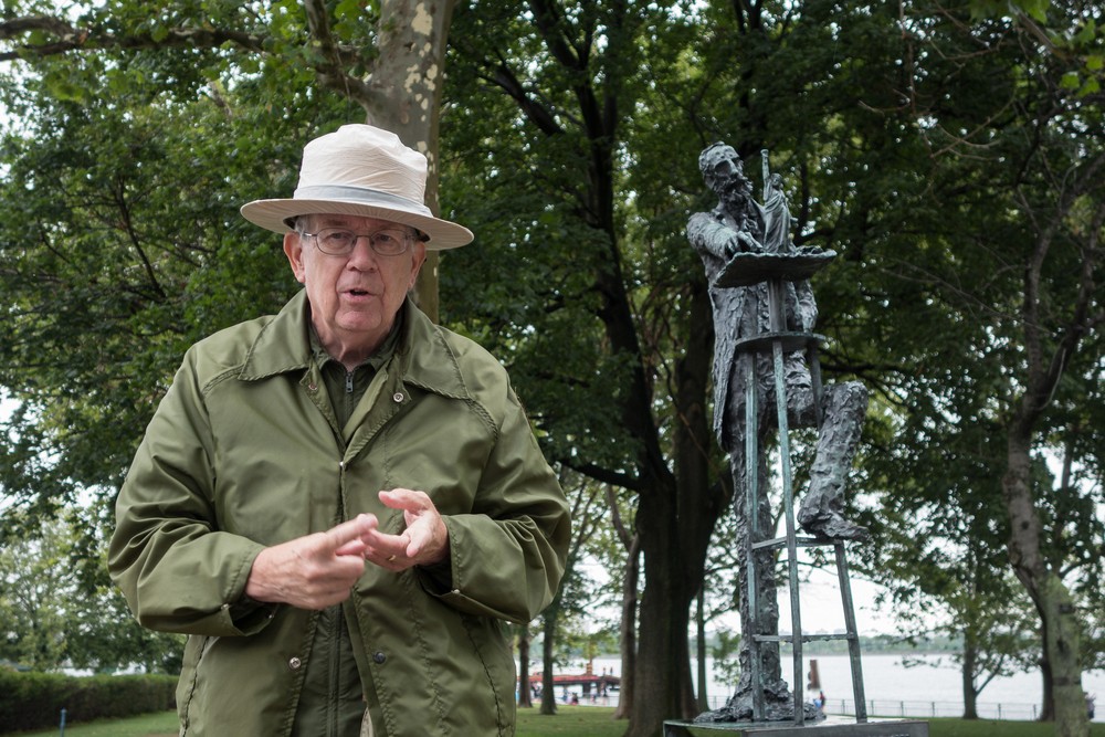 Park Ranger at Liberty Island and sculpture of Frederic Auguste Bartholdi, who sculpted the Statue of Liberty.<br />July 13, 2017 - Manhattan, New York City, New  York.
