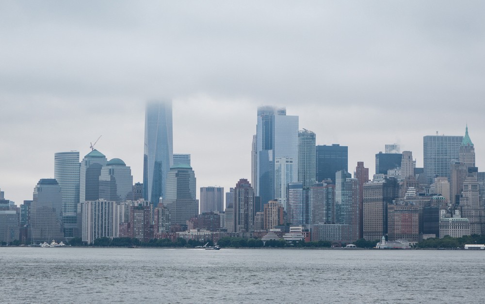 Lower Manhattan from ferry from Libery Island to Ellis Island.<br />July 13, 2017 - Manhattan, New York City, New  York.