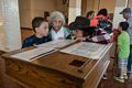 Matthew, Joyce, and Miranda looking at a passenger list in the Great Hall of the main building on Ellis Island.<br />July 13, 2017 - Manhattan, New York City, New  York.
