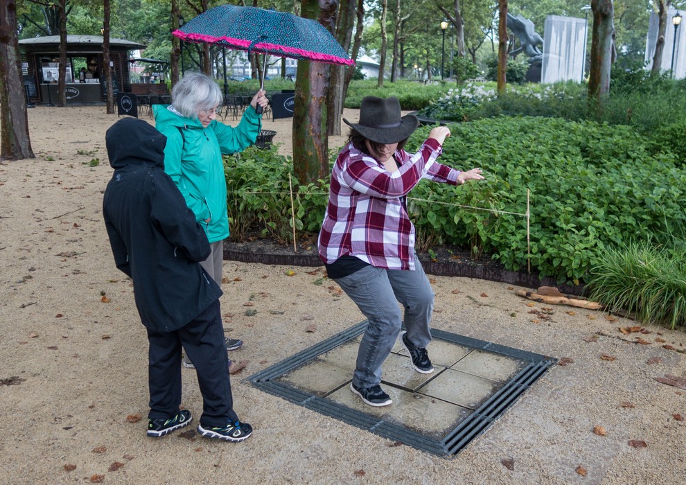 Joyce watching Miranda and Matthew play on the musical tiles.<br />July 13, 2017 - Manhattan, New York City, New  York.