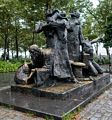 Immigrants sculpture by Luis Sanguina, Battery Park.<br />July 13, 2017 - Manhattan, New York City, New  York.