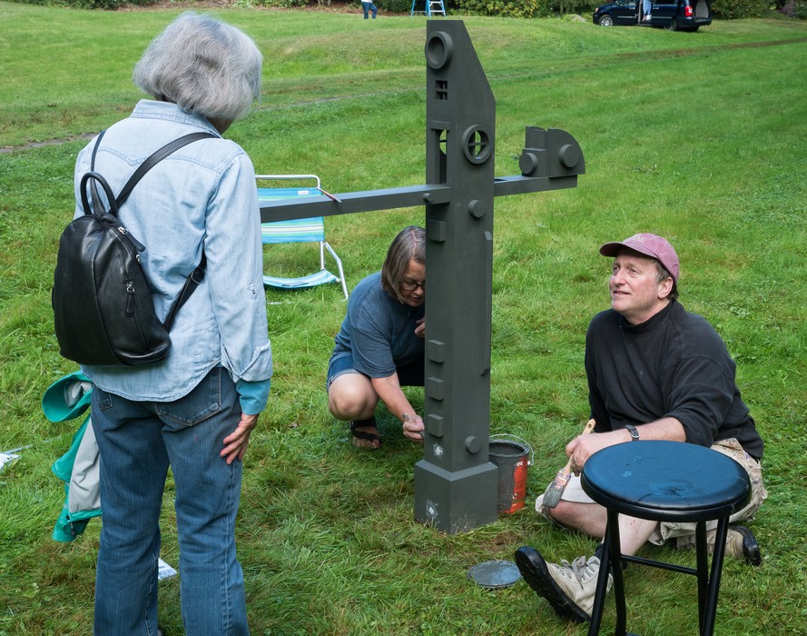Joyce talking to Deb and David Davies painting his 'Transit Point'.<br />Maudslay Outdoor Sculpture show installation.<br />Sep. 9, 2017 - Maudslay State Park, Newburyport, Massachusetts.