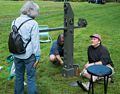 Joyce talking to Deb and David Davies painting his 'Transit Point'.<br />Maudslay Outdoor Sculpture show installation.<br />Sep. 9, 2017 - Maudslay State Park, Newburyport, Massachusetts.