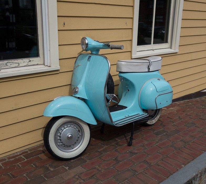 An old Vespa scooter parket at the side of the Newburyport Art Association's building.<br />Sept. 21, 2017 - Newburyport, Massachusetts.