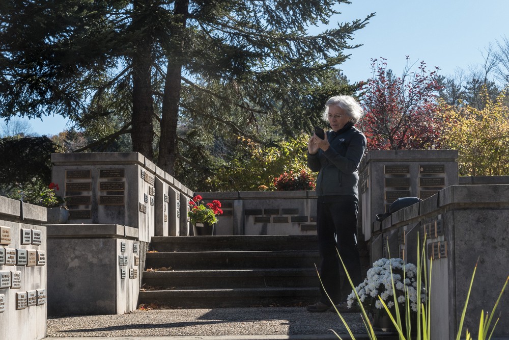 Joyce checking her photo of the birch tree.<br />Oct. 20, 2017 - Latvian Memorial Park, Tannersville, New York.
