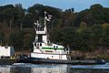 Tugboat pushing barge North on the Hudson River.<br />Oct. 21, 2017 - Saugerties Lighthouse, Saugerties, New York.