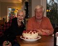 Cake made by Priscilla for Lilita's birthday. Her brother John making sure he gets a piece.<br />Dec. 2, 2017 - At John and Priscilla's in Newmarket, New Hampshire.