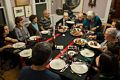 Joyce serving lamb ribs.<br />Thirteen of us around the enlarged table.<br />Dec. 25, 2017 - At home in Merrimac, Massachusetts.