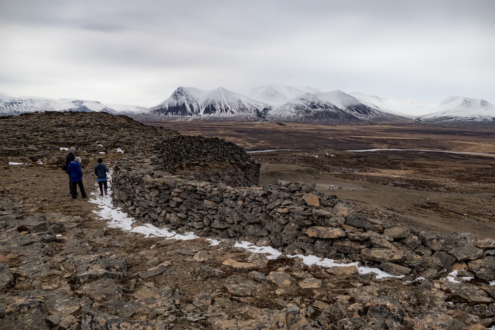 Eric, Joyce, and Marks along a man made stone wall atop the volcanic formation.<br />April 17, 2017 - At Borgarvirki off Rte. 1, Iceland.
