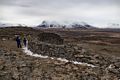 Eric, Joyce, and Marks along a man made stone wall atop the volcanic formation.<br />April 17, 2017 - At Borgarvirki off Rte. 1, Iceland.