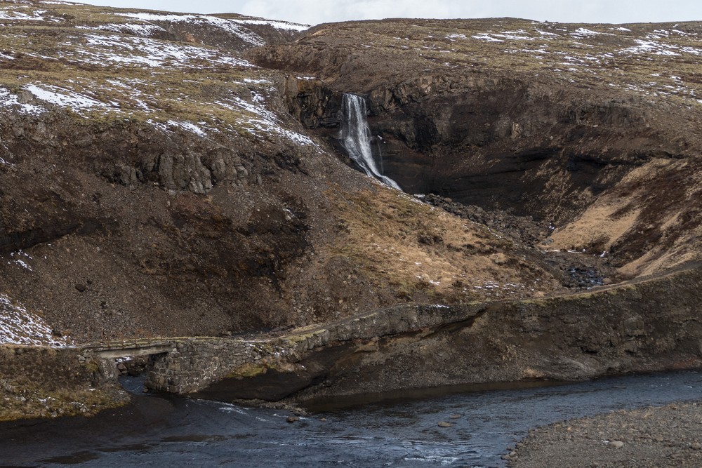 Old bridge, old road, and waterfall at a place designated as Kattarhryggur.<br />April 22, 2017 - Somewhere along Rte. 1 between Hvammstangi and Reykjavik, Iceland.