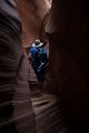Carl snaking through a narrow passage.<br />Aug. 11, 2017 - Rattlesnake slot canyon near Page Arizona.