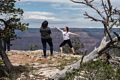 Tourist posing for a photo.<br />Along the Rim Trail.<br />Aug. 12, 2017 - Grand Canyon National Park, Arizona.