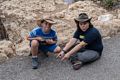 Matthew and Miranda pointing to marker for 240 million years ago, the start of the dinosaurs?<br />Trail of Time along the Rim Trail.<br />Aug. 12, 2017 - Grand Canyon National Park, Arizona.