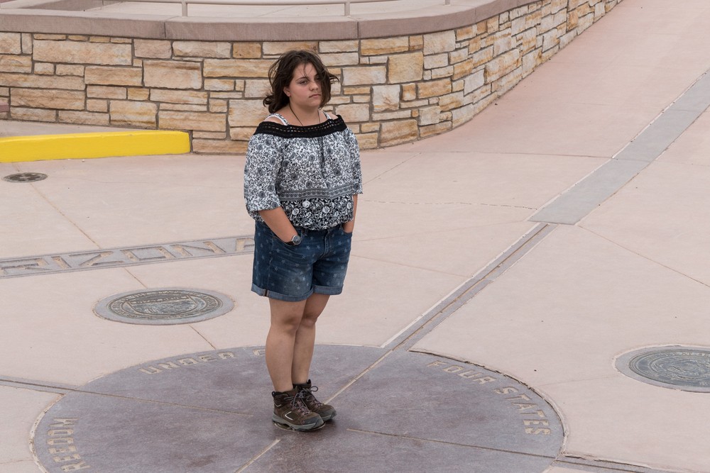 Miranda at the Four Corners Monument.<br />Aug. 15, 2017 - Four Corners, Arizona, Colorado, New Mexico, Utah.