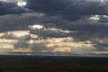 View West of clouds and the San Juan Range near sunset.<br />Aug. 17, 2017 - Great Sand Dunes Lodge, Mosca, Colorado.