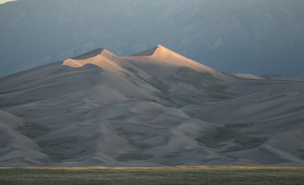 View of dunes of the Great Sand Dunes National Park at sunrise.<br />Aug. 18, 2017 - Great Sand Dunes Lodge, Mosca, Colorado.