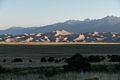 View of dunes of the Great Sand Dunes National Park at sunrise with the Sangre de Cristo Mountains in back.<br />Aug. 18, 2017 - Great Sand Dunes Lodge, Mosca, Colorado.
