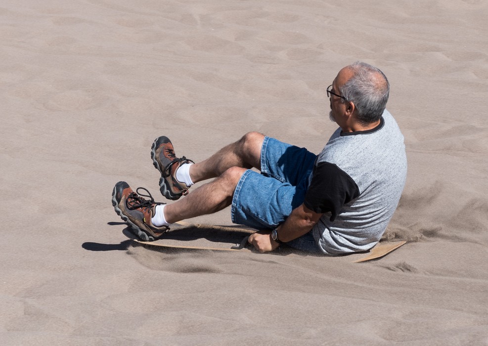 Carl flying down the dune.<br />Aug. 18, 2017 - Great Sand Dunes National Park, Colorado.