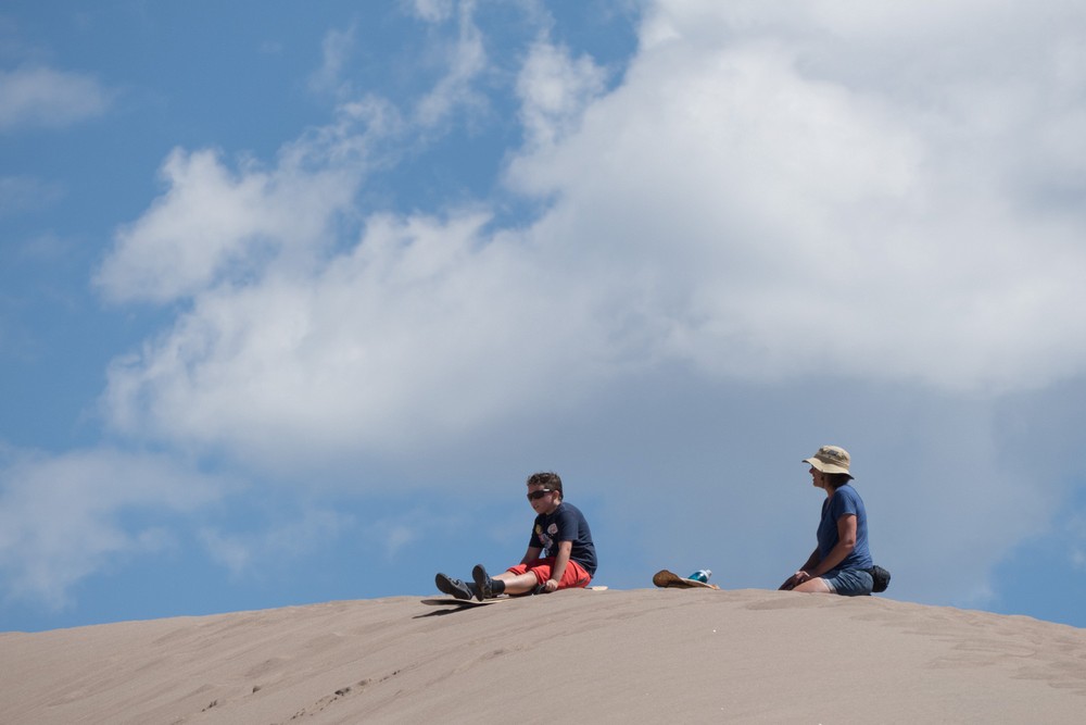 Matthew ready for another ride. Holly watches.<br />Aug. 18, 2017 - Great Sand Dunes National Park, Colorado.