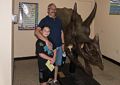 Matthew and Carl and horned skull of a triceratops.<br />Dinosaur Ridge.<br />Aug. 19, 2017 - Morrison, Colorado.