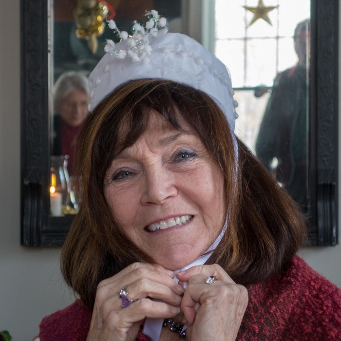 Carole wearing the queen's crown for assigning pieces of the galette de roi (Three Kings Day traditional food in France).<br />Jan. 6, 2018 - At Paul and Dominique's in Newbury, Massachusetts.
