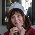 Carole wearing the queen's crown for assigning pieces of the galette de roi (Three Kings Day traditional food in France).<br />Jan. 6, 2018 - At Paul and Dominique's in Newbury, Massachusetts.