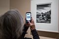 Joyce photographing a photo by Philippe Halsman (born in Riga in 1906).<br />Georgia O'Keeffe exhibit.<br />Jan. 26, 2018 - PEM, Salem, Massachusetts.