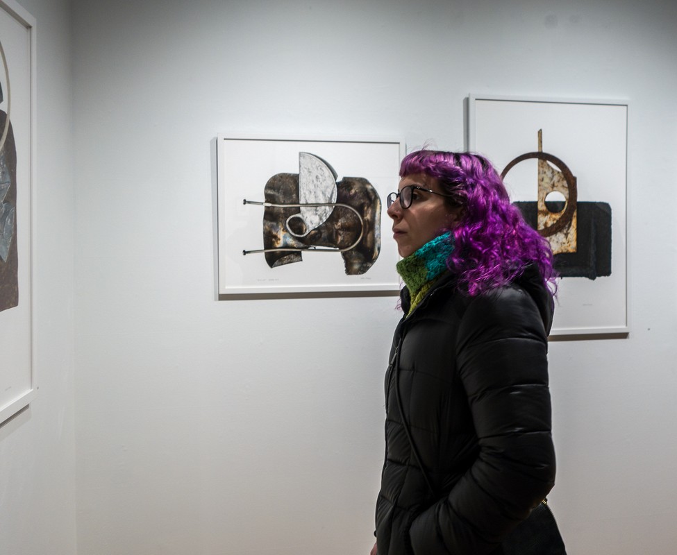 Looking at lookers (woman with purple hair).<br />Looking at art with Paul and Dominique.<br />March 9, 2018 - SoWa district, Boston, Massachusetts.