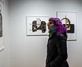 Looking at lookers (woman with purple hair).<br />Looking at art with Paul and Dominique.<br />March 9, 2018 - SoWa district, Boston, Massachusetts.