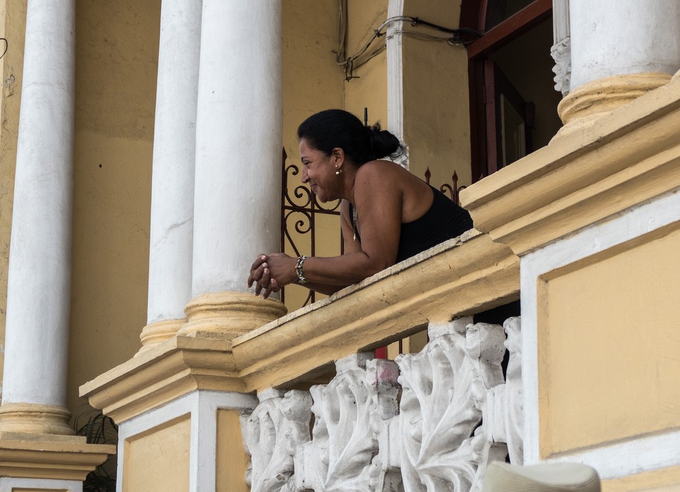 Woman on balcony.<br />Oct 30, 2016 - Santiago de Cuba.