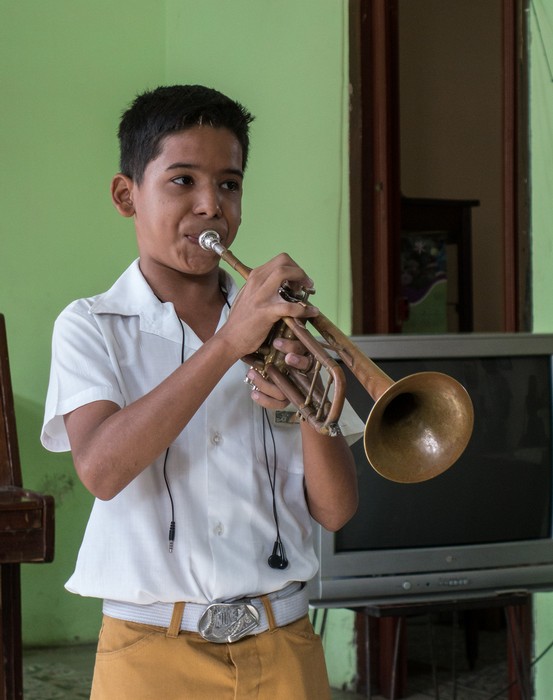 Eleven year old Cristian playing the trumpet.<br />"Lauro Fuentes" Community Music School <br />Nov. 1, 2016 - Santiago de Cuba.