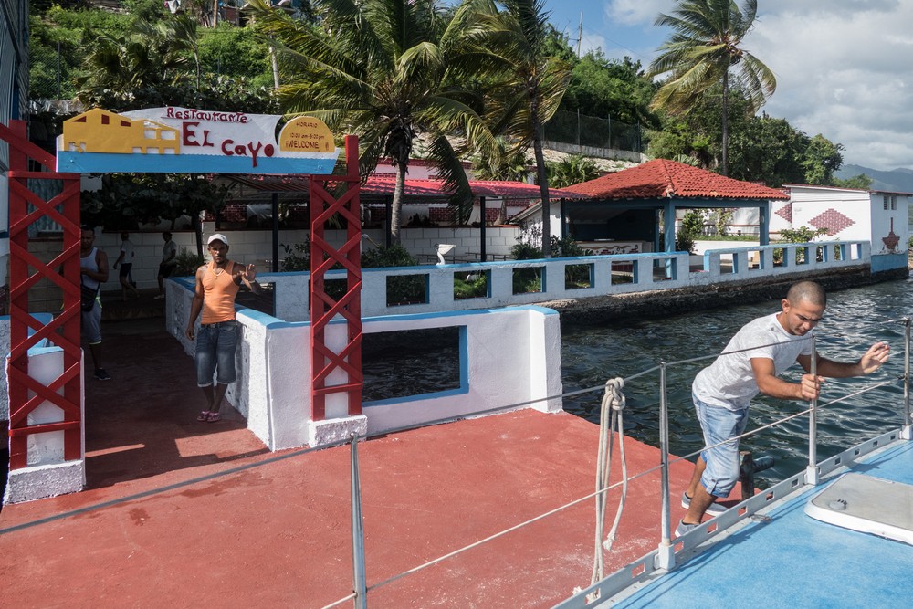 Docking at "El Cayo" restaurant with help from Pedro.<br />Nov. 1, 2016 - Granma Island. Santiago de Cuba.