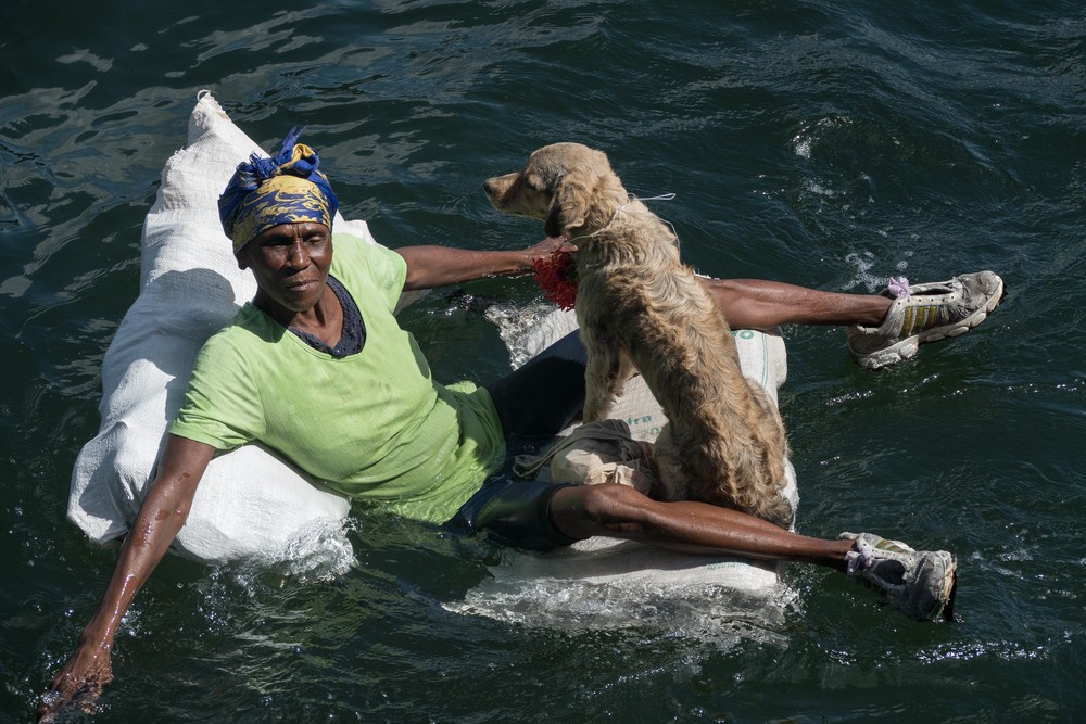 Teresa and her dog.<br />Nov. 1, 2016 - Granma Island, Santiago de Cuba.