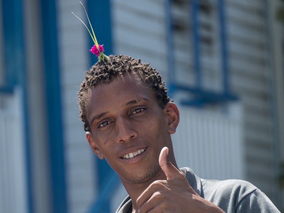 Grasshopper decorated local man.<br />Nov. 1, 2016 - Granma Island, Santiago de Cuba.