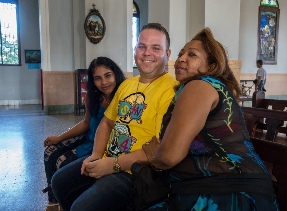 Locals who wanted me to take their photo at Our Lady of Charity Basilica.<br />Nov. 2, 2016 - El Cobre, Cuba.