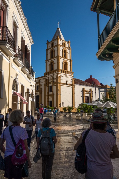 Joy, Joyce, and Irma heading for our bus.<br />Iglesia de Nuestra Se�ora de la Soledad, in front of us.<br />Nov. 3, 2016 - Camag�ey, Cuba.