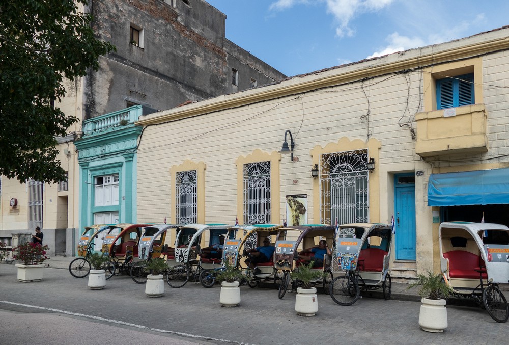 Bicitaxis in front of the house of artists Ileana and Joel Jover.<br />Nov. 3, 2016 - Camag�ey, Cuba.
