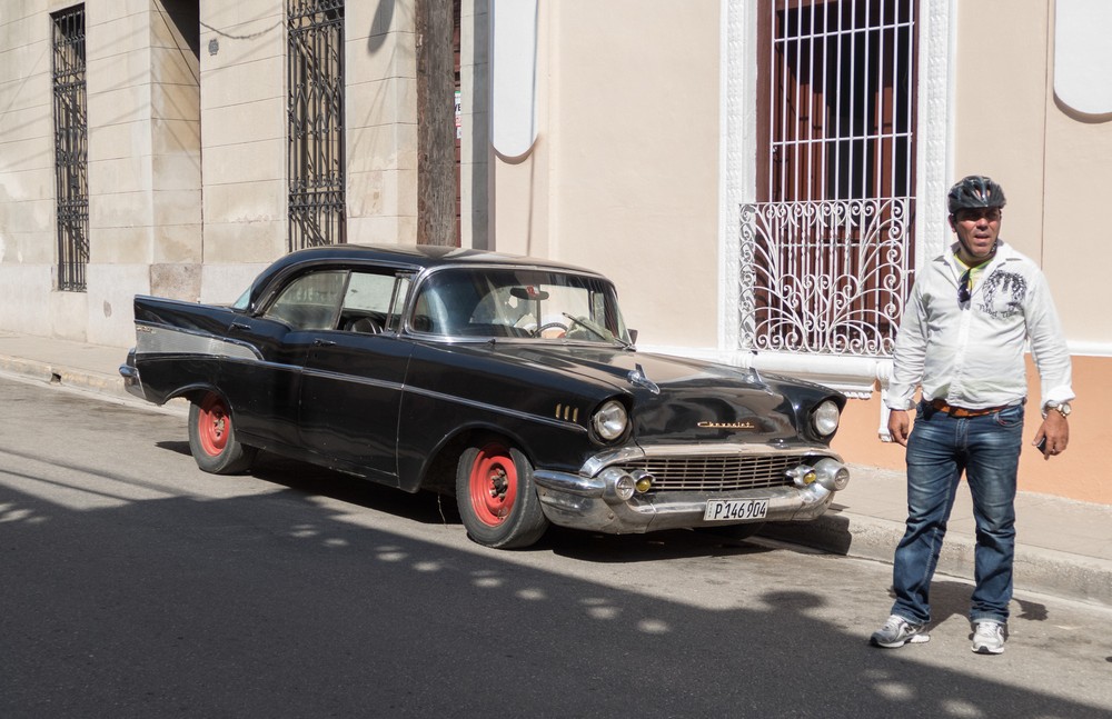 '57 Chevy and a motorcyclist.<br />Nov. 3, 2016 - Camag�ey, Cuba.
