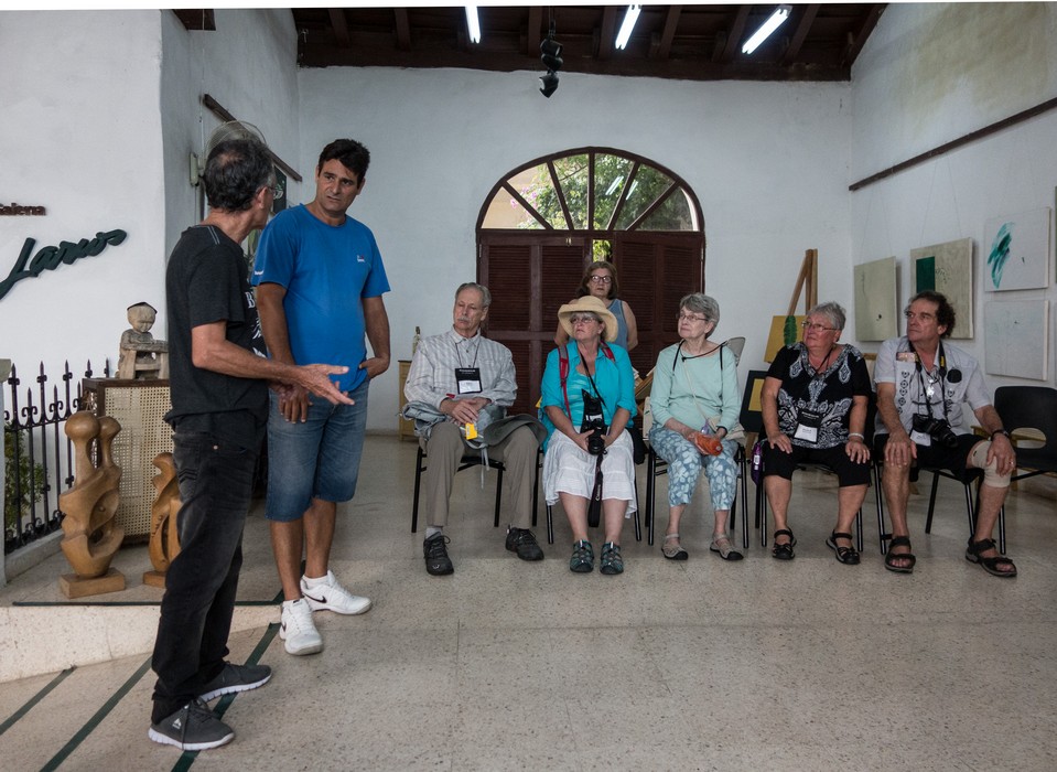 Oreste Larios, Osmar doing the translating, Bob, Janet, Madelyn, Norma, and Paul.<br />Road Scholars visiting the Larios art gallery and studios (of various artists)<br />Nov. 3, 2016 - Camag�ey, Cuba.