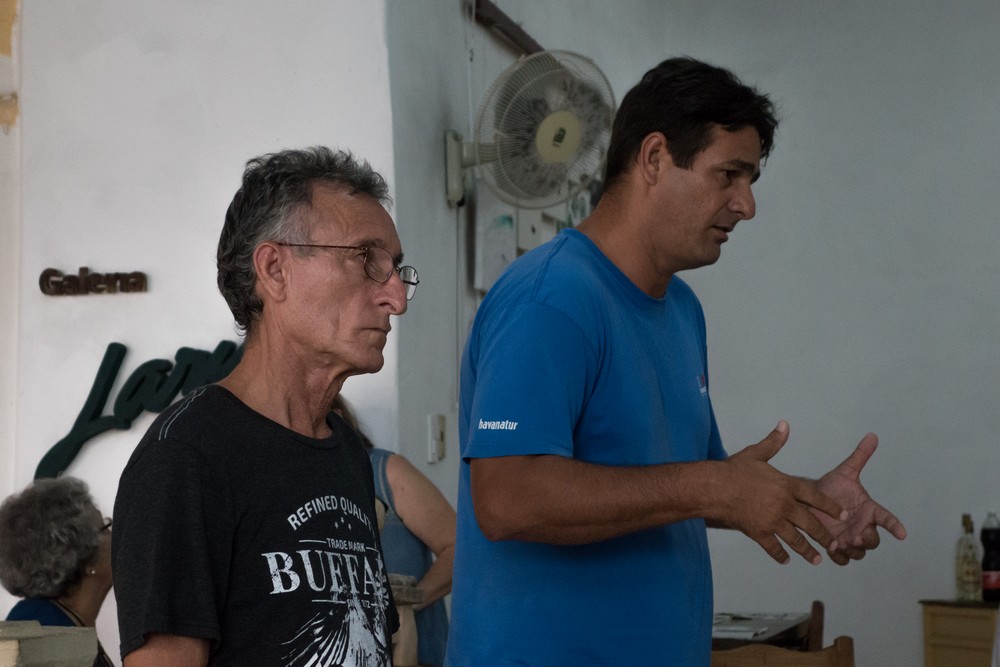 Oreste Larios and Osmar.<br />Road Scholars visiting the Larios art gallery and studios (of various artists)<br />Nov. 3, 2016 - Camag�ey, Cuba.