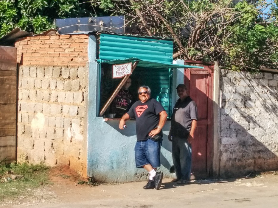 Eddie in front of a cold drink stand<br />near our casa particular, the Hostal La Palmita.<br />Nov. 5, 2016 - Trinidad, Cuba.
