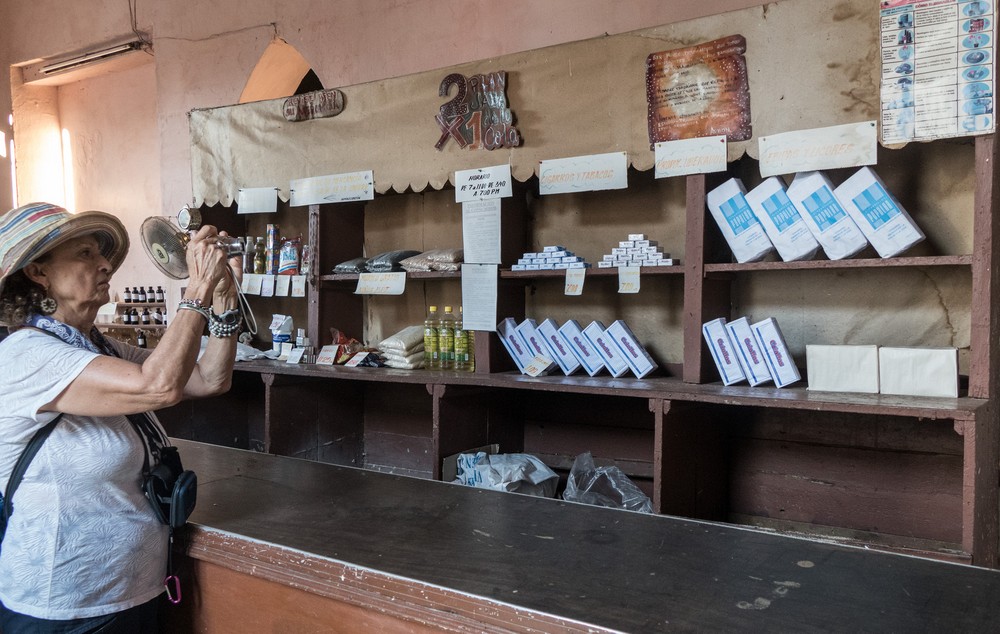 Irma photographing the scant provisions at the rationing store.<br />Nov. 5, 2016 - Trinidad, Cuba.